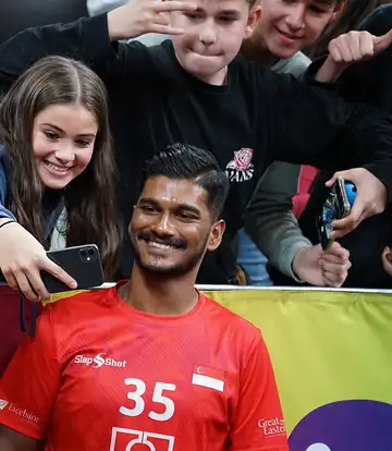 Smiling fans celebrating and taking a selfie together