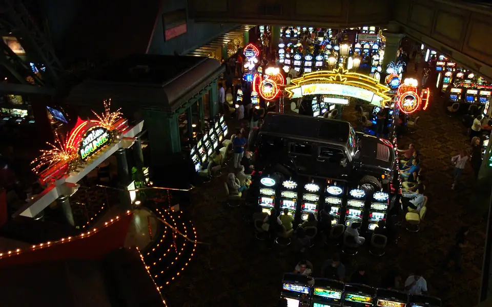 Players at rows of slot machines on a gaming floor